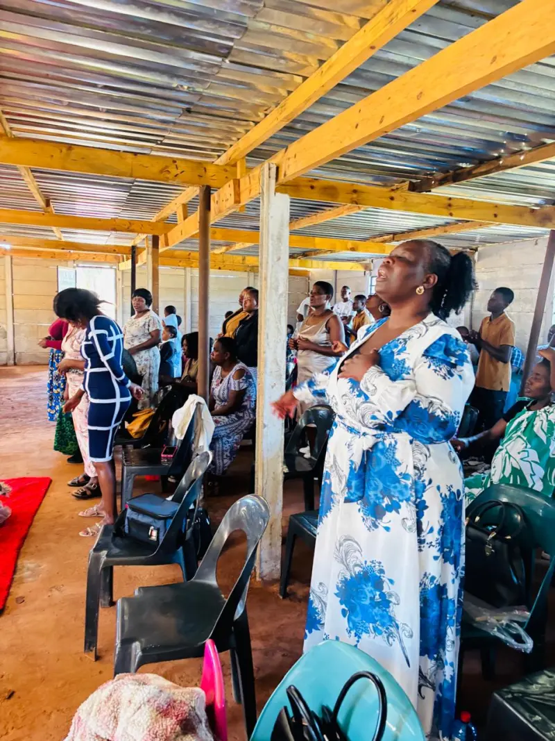 A member of the Truevine congregation worshipping
